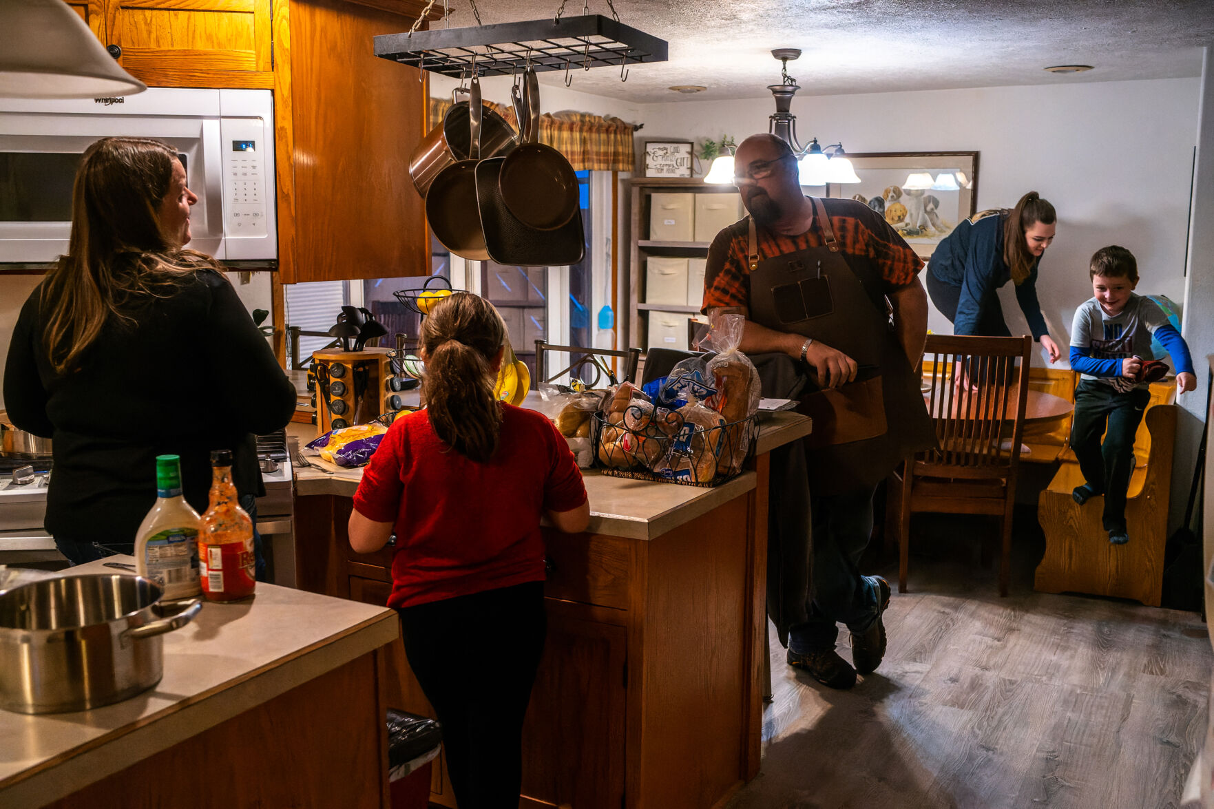 The Rogers family gathers in the kitchen to play and talk